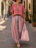 Two-piece Set Featuring A Casual Linen-cotton Top And Striped Trousers.