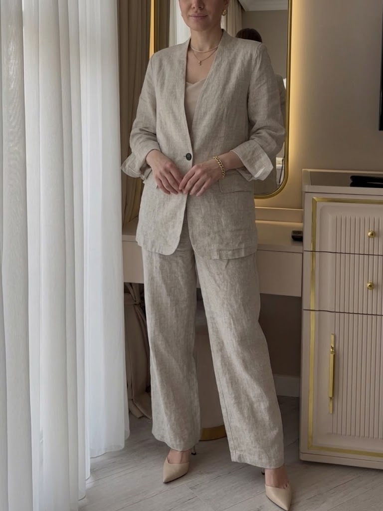 Two-piece Set Featuring A Casual Knit Cotton Top With Cut-out Details And Contrasting Color Trims, Paired With Linen-cotton Blend Trousers.