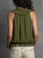 Stylish And Elegant Sleeveless Half-zip Top With A Ruffled Collar.